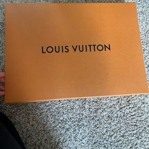 Louis Vuitton box (I think from a scarf or a shirt )